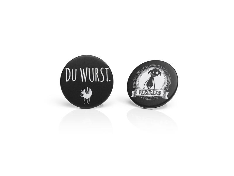 Pechkeks GmbH Button 2er Set, «Du Wurst», Farbe: Schwarz, Themenwelt: Pechkeks